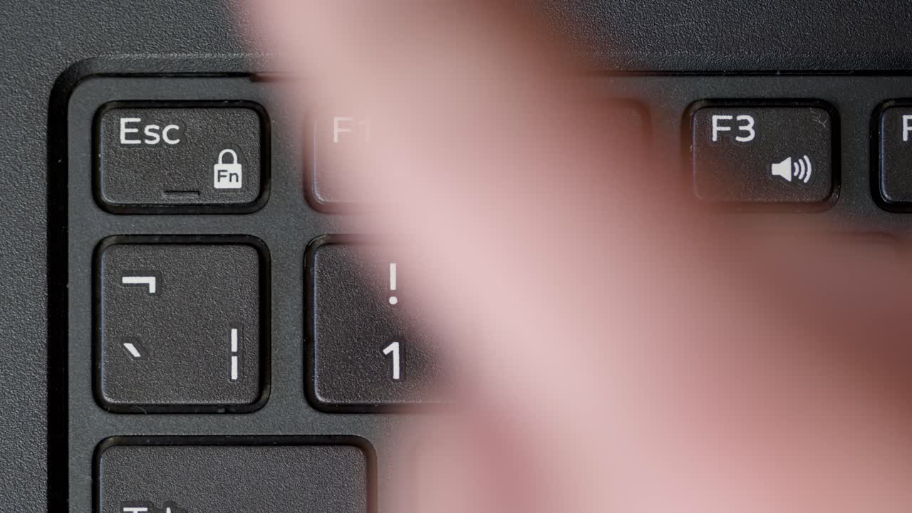 Top View Finger Pressing Esc Button Keyboard