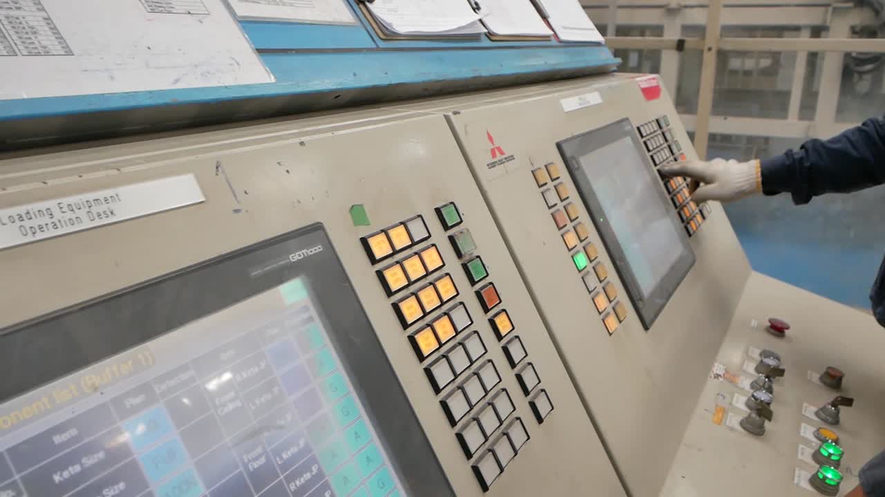Technician Operate on Control Panel in Factory, Editorial