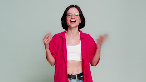 young woman celebrating win with joyful smile expressing happiness success achievement excitement