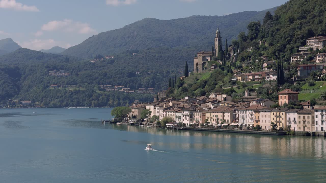 Small boat heading towards Morcote in Switzerland