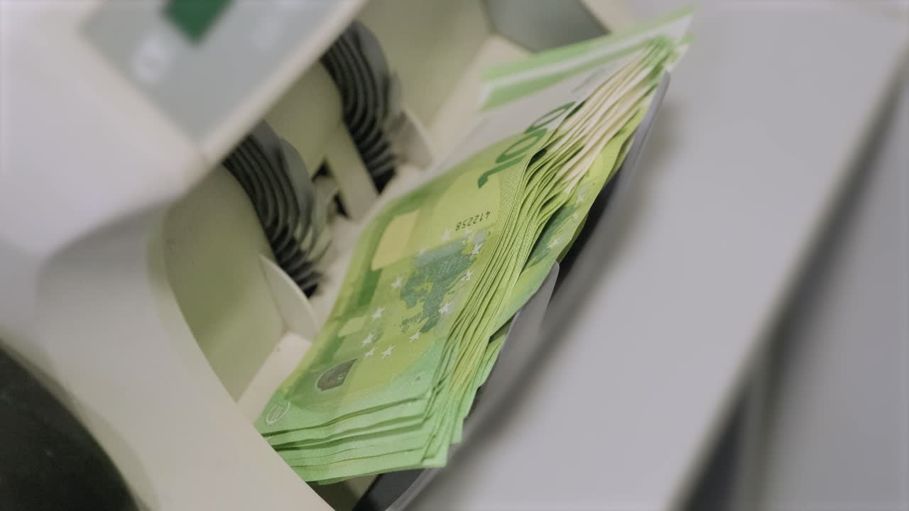 The calculating machine counts euro bills Thousand euro. New bills