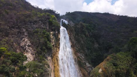 el chiflon waterfall cascading over canyon in chiapas mexico, 4k aerial reveal