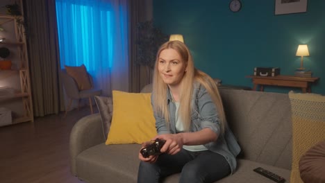 woman playing video games at home