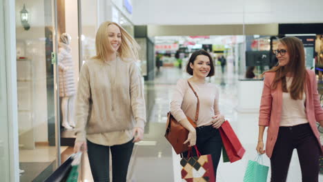 three women shopping at a mall