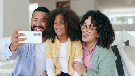 Mother,-father-and-child-selfie-on-sofa-for-home