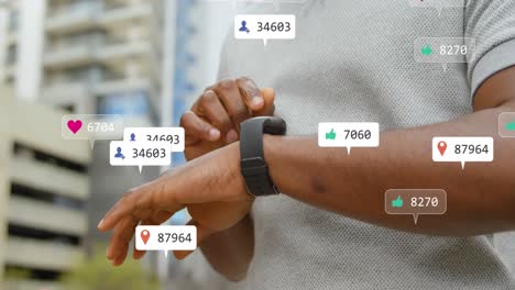 animation of multiple social media icons over mid section of a man using smartwatch outdoors