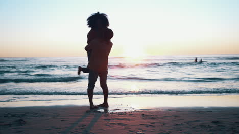 Hug,-sunset-and-couple-with-silhouette