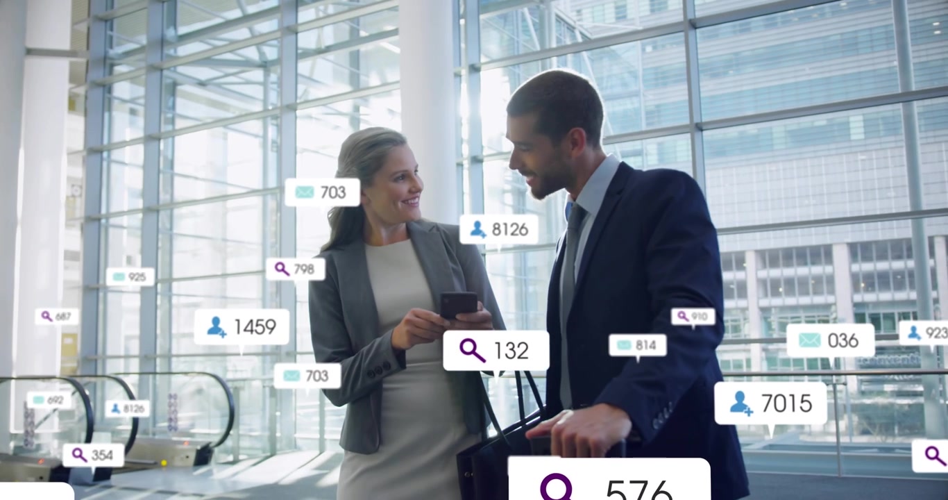 Businesswoman holding smartphone, data labels appearing, shaking hands with man, sharing itinerary