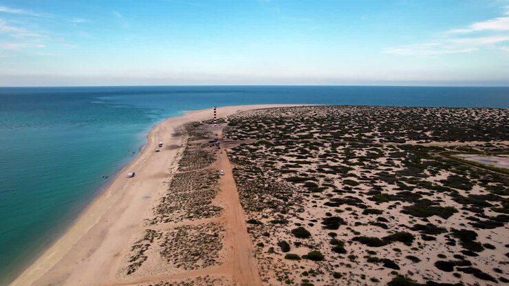 Drone shot and front view the window beach lighthouse in baja california sur mexico
