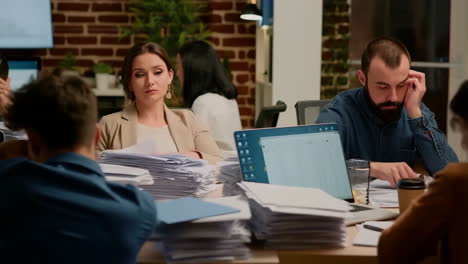 busy office employees working overtime