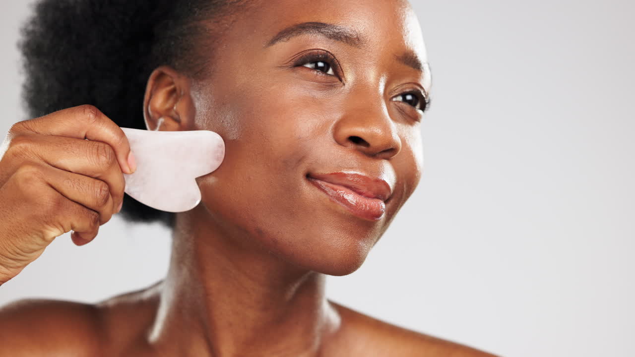 Facial, massage and stone with a black woman