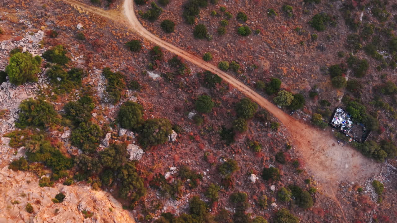 Red terrain surface pattern in Sicily, Italy, shot from above
