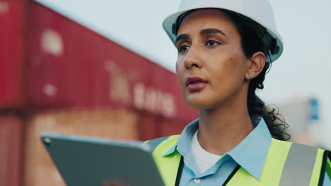 female port worker using tablet at container terminal