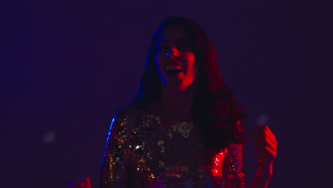 close up of woman in nightclub bar or disco dancing and having fun 4