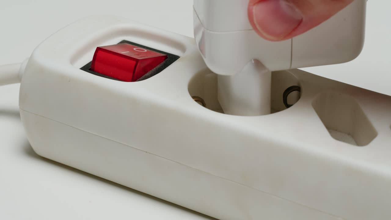 Plugging in an extension cord