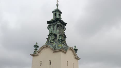 a church tower with a cross on top