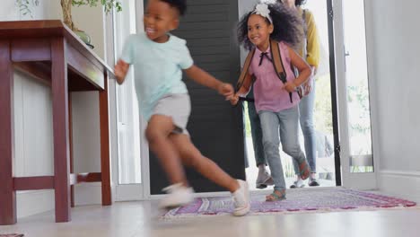 front view of black family entering in the house 4k