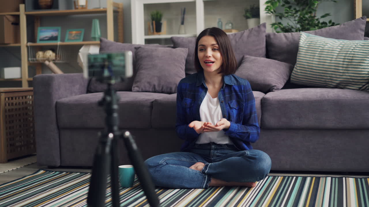 Woman vlogging at home