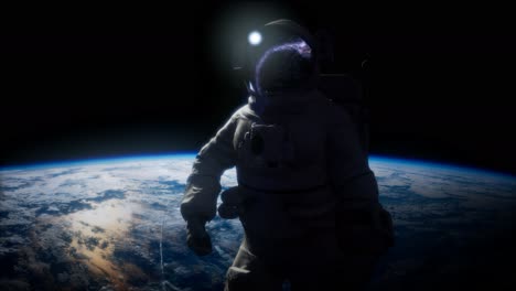 astronauta en el espacio exterior con el telón de fondo del planeta tierra. imagen de la tierra proporcionada por la nasa
