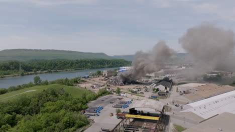 Wide-aerial-shot-of-a-large-fire-in-a-scrap-metal-yard-in-Chattanooga,-TN