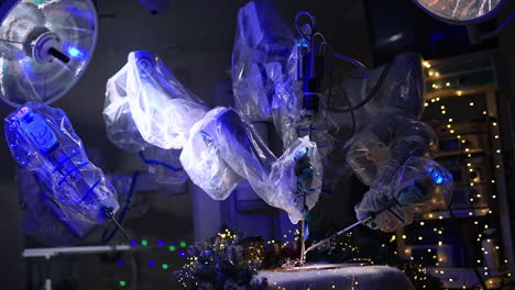 modern surgical room with advanced robotic equipment in dim light. machine arms covered in plastic write using an old writing pen. lights and garlands at backdrop.