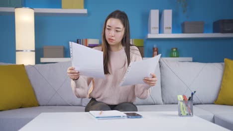 asian young woman undecided at home office.