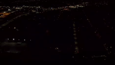 Aerial-shot-of-fireworks-with-city-lights-in-the-background