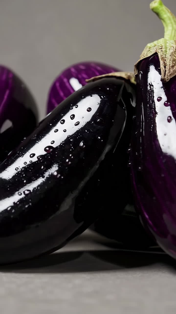 Close-up of Fresh Eggplants with Water Droplets
