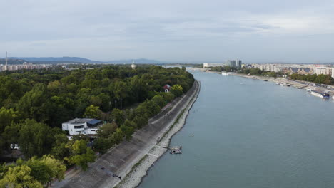 aerial - margaret island, danube river, budapest, hungary, forward descending shot