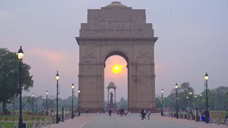 beautiful sunrise at india gate on kartavya path with tourists and locals enjoying the view, new delhi, india