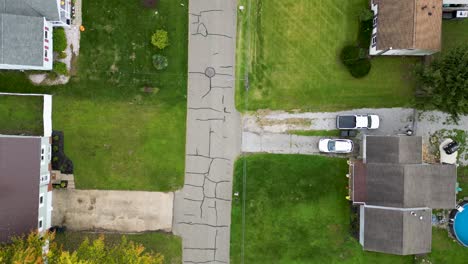 aerial view of a residential neighborhood with cracked pavement