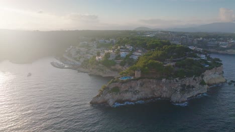 Aerial-view-of-tropic-Mediterranean-coastline-city,-bright-sunlight,-Mallorca