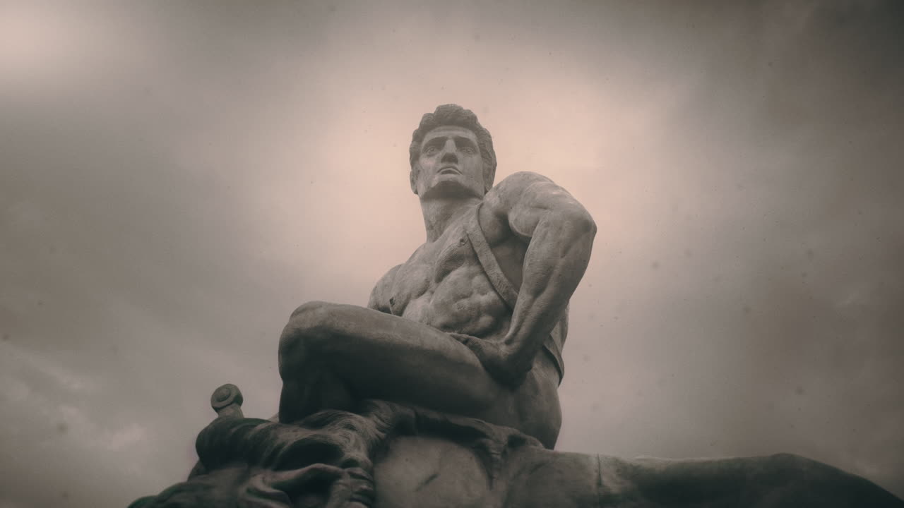 Epic, ancient stone statue on cloudy day and windy weather.
