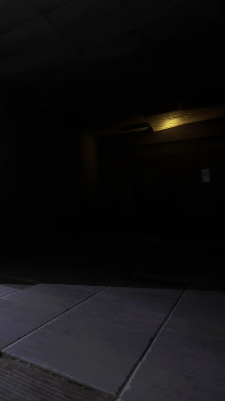 Light in the dark room shows a floor and wall at night