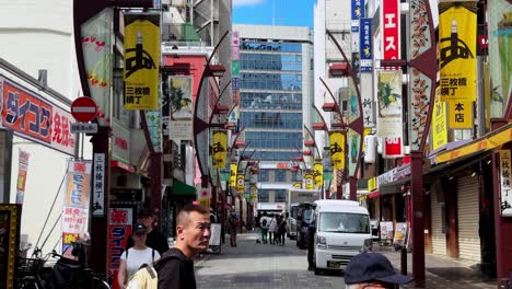 busy street scene in mikawacho, tokyo, japan