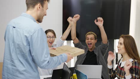 office workers decided to take a break and eat some pizza