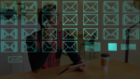 using tablet and phone, man interacting with email animation in cafe