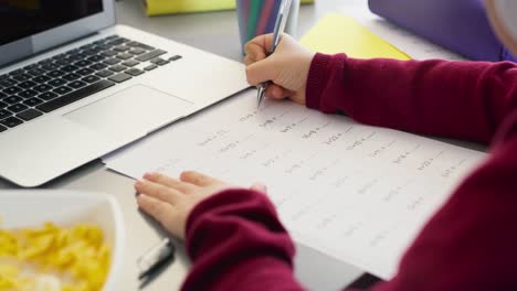 Close-up-of-video-child-doing-math-homework