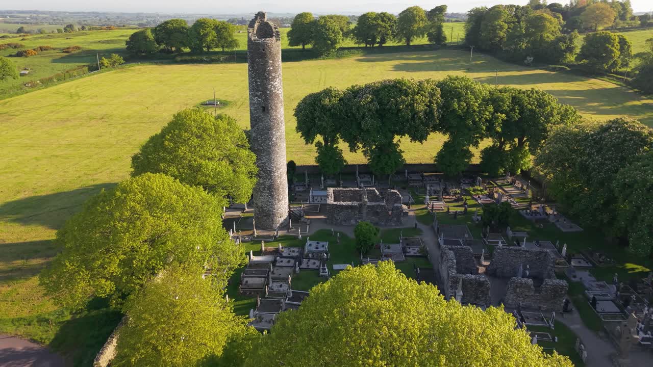 Aerial view of Monasterboice ruins in a lush Irish countryside setting