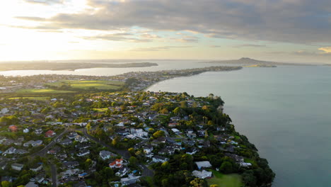 aerial view of a coastal residential area at sunset