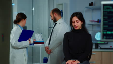 team of scientists doctor discussing health status of patient