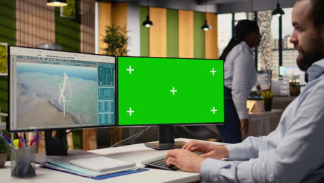 Engineer Working On Futuristic Wind Turbine Concept On Green Screen Pc