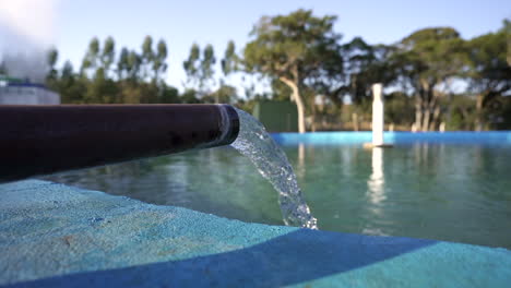 water flowing from a pipe, illustrating a basic element of water supply and distribution
