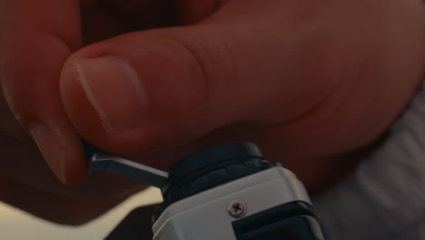 adjusting a vintage film camera