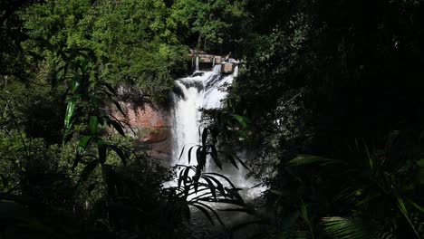 A-zoom-out-of-this-cascading-waterfall,-Heo-Suwat-Waterfall,-Khao-Yai-National-Park,-Thailand