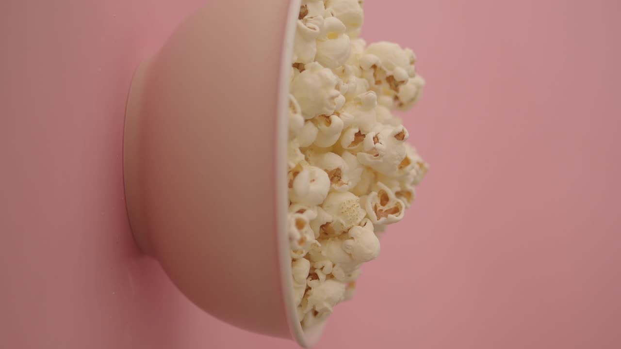 Bowl of Popcorn on a Pink Background