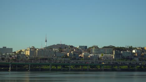the yongsan district of seoul, south korea and the historic namsan tower on a clear day over the han river