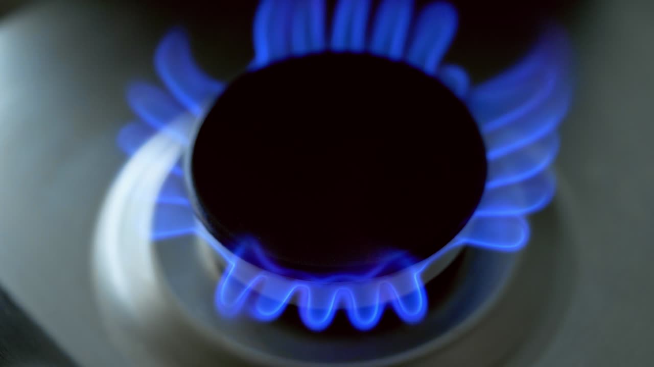 Fire from gas kitchen stove. Gas burner on modern kitchen stove