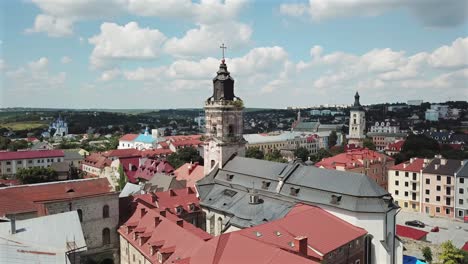 aerial view circle pan left of dominican monastery at kamyanets podilsky,ukraine on a sunny day with white clouds.