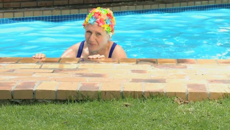 old woman smiling at the camera after swimming